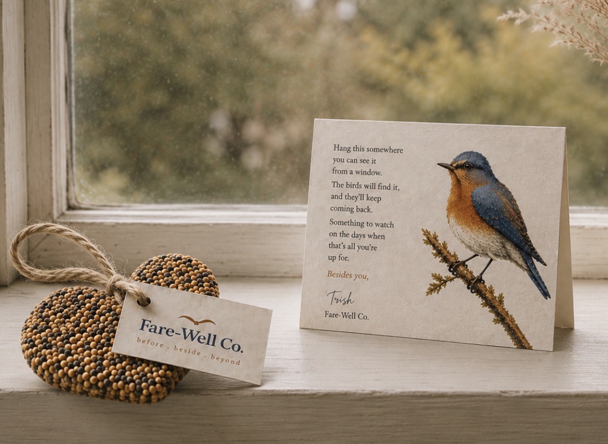 Fare-Well Co. memorial birdseed ornament resting beside its handwritten card on a windowsill